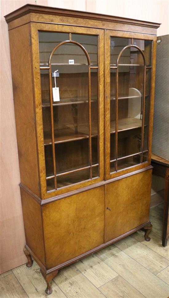 A George I style burr walnut bookcase H.165cm